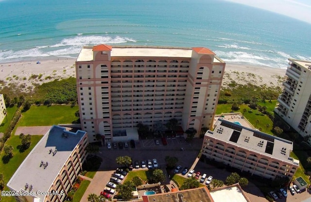 aerial view featuring a water view and a beach view