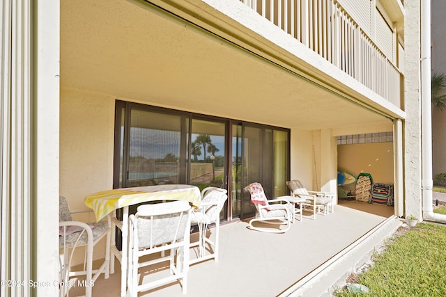 view of patio / terrace with a balcony