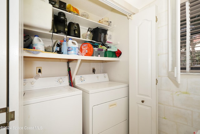 clothes washing area featuring washing machine and clothes dryer