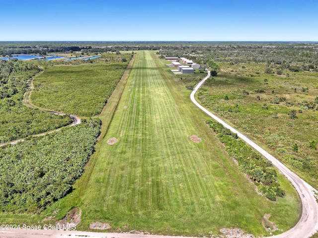 birds eye view of property with a water view and a rural view