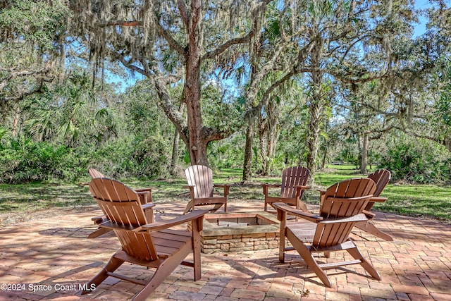 view of patio featuring an outdoor fire pit