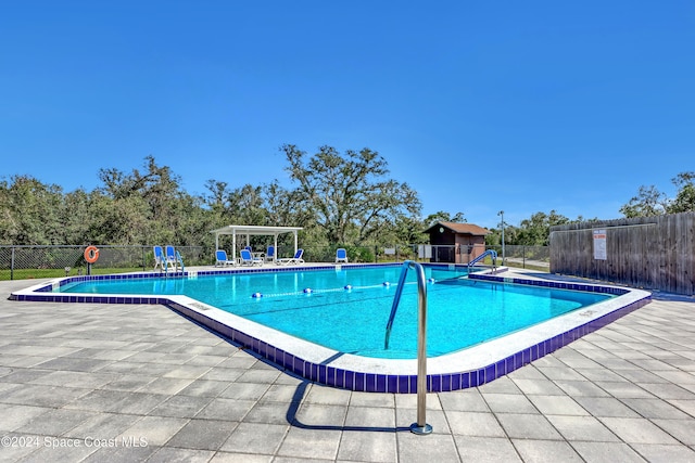 view of swimming pool with a patio area