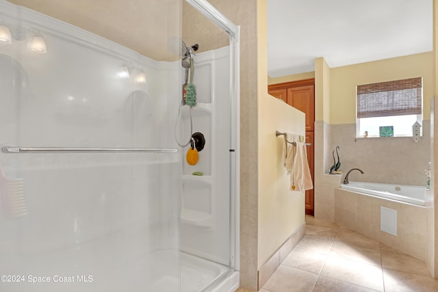 bathroom featuring independent shower and bath and tile patterned floors