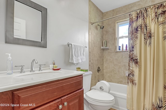 full bathroom with toilet, vanity, and shower / bath combination with curtain