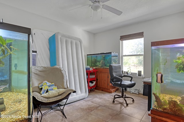 tiled office space with ceiling fan