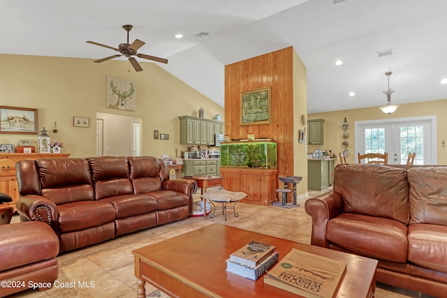 living room with french doors, ceiling fan, light tile patterned flooring, and lofted ceiling