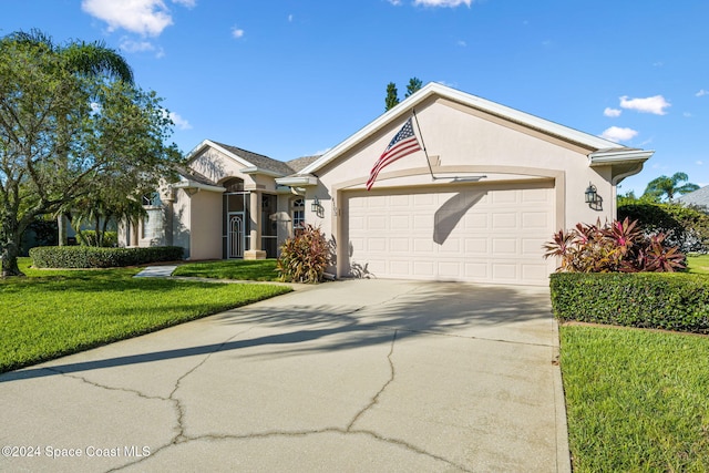 ranch-style house with a garage and a front lawn