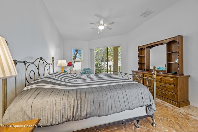 bedroom featuring ceiling fan and lofted ceiling