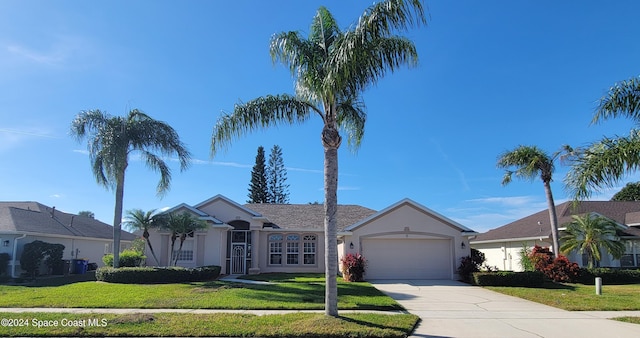 ranch-style house with a front yard and a garage