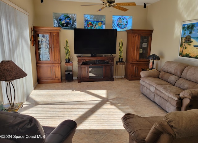 tiled living room featuring ceiling fan