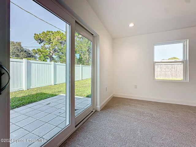 entryway with light colored carpet