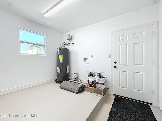 utility room featuring water heater