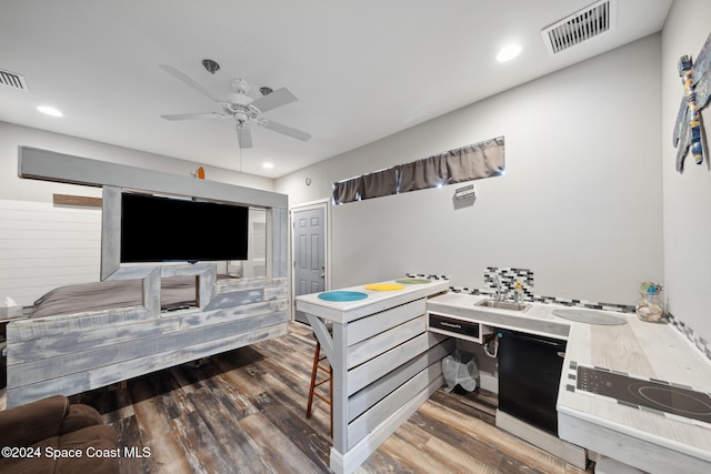 bedroom with a closet, dark hardwood / wood-style floors, and ceiling fan