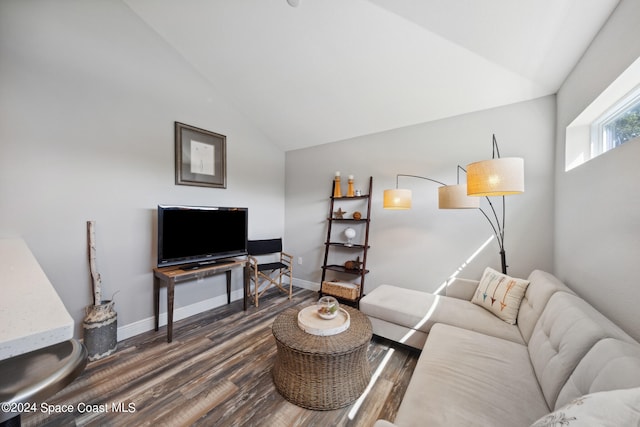 living room with vaulted ceiling and dark hardwood / wood-style floors