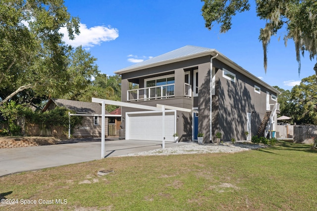 view of front facade featuring a front yard and a garage