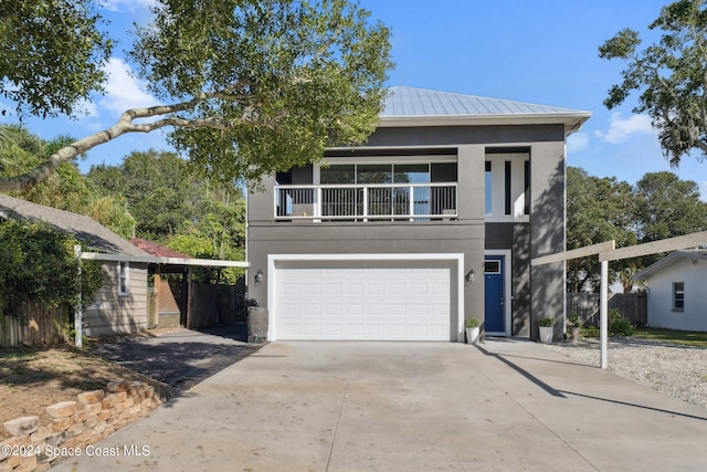 view of front of house featuring a balcony and a garage