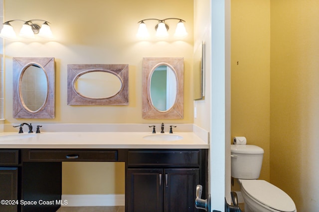 bathroom with toilet and vanity