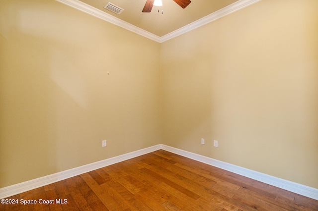 spare room with ornamental molding, wood-type flooring, and ceiling fan