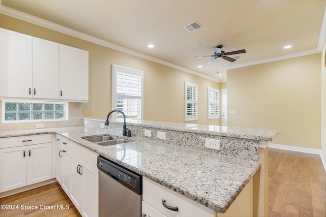 kitchen featuring sink, kitchen peninsula, light hardwood / wood-style flooring, white cabinets, and dishwasher