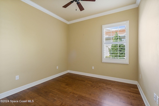 empty room with hardwood / wood-style flooring, ceiling fan, and crown molding