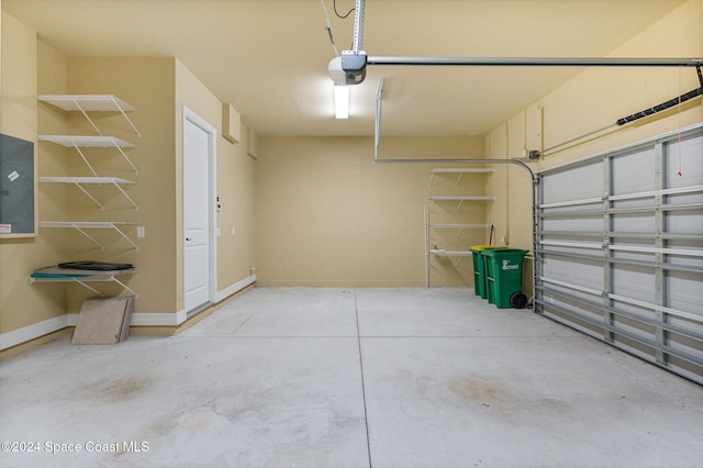 garage featuring a garage door opener and electric panel