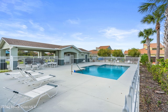 view of swimming pool featuring a patio