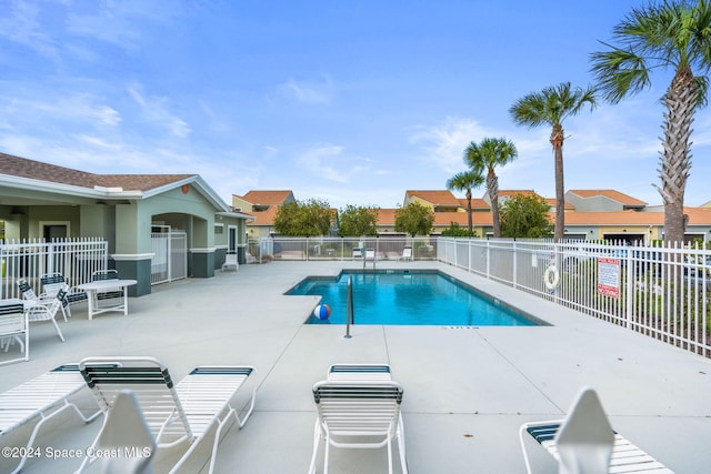 view of swimming pool with a patio