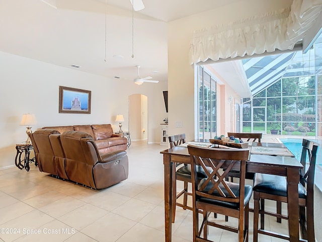 dining room with ceiling fan and light tile patterned flooring