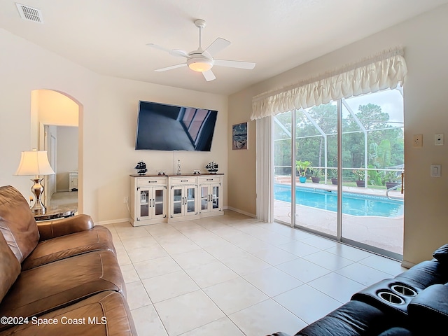 living room featuring ceiling fan and light tile patterned floors