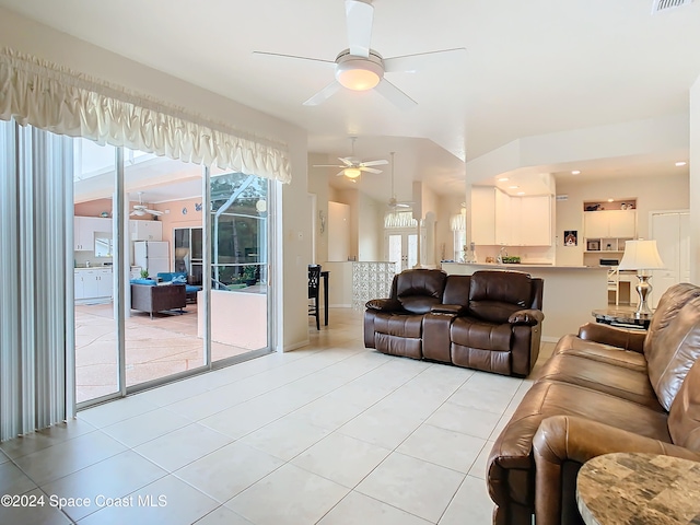 tiled living room featuring ceiling fan