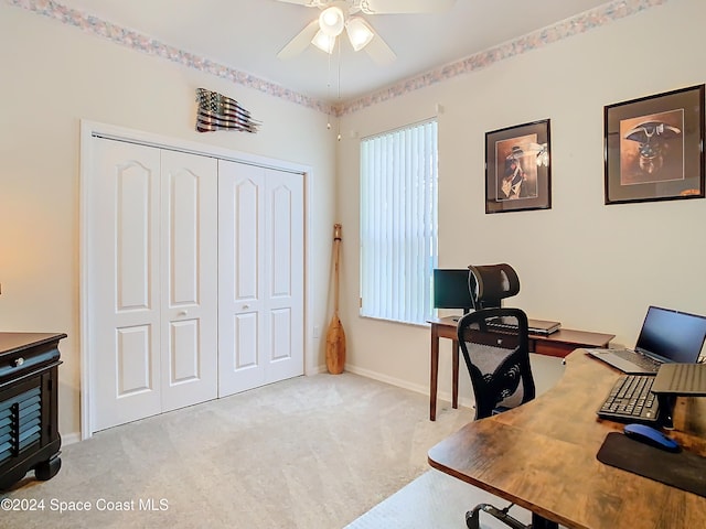 home office featuring light colored carpet and ceiling fan