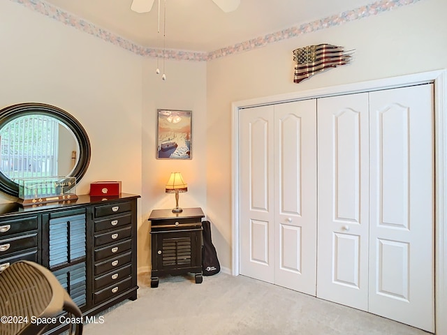 carpeted home office with ceiling fan