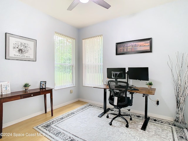 office area featuring light hardwood / wood-style floors and ceiling fan