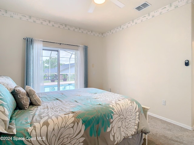 carpeted bedroom featuring access to exterior and ceiling fan