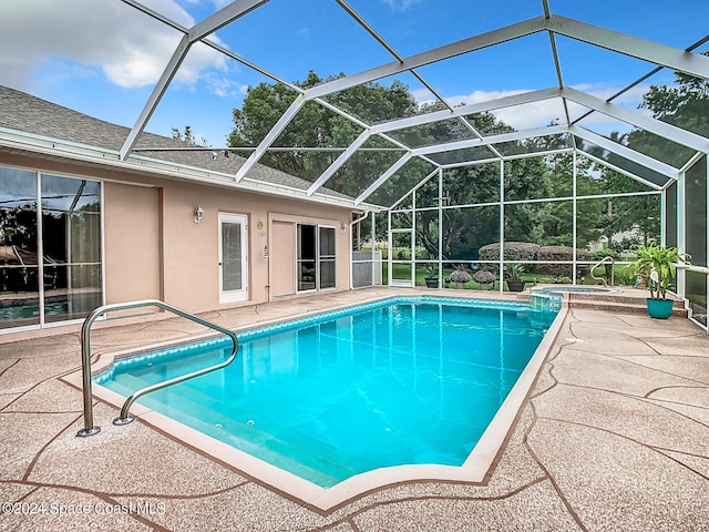 view of pool featuring a patio area and a lanai