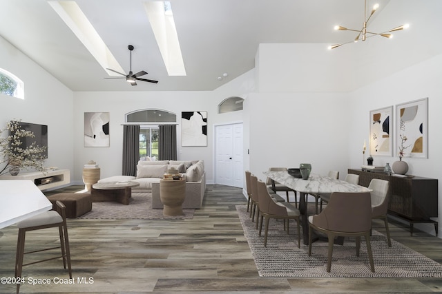 480 Prestwick Ct, Melbourne, FL 32940 - dining room with a skylight, an inviting chandelier, wood finished floors, and high vaulted ceiling
