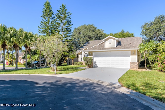 view of front of home featuring a front lawn and a garage