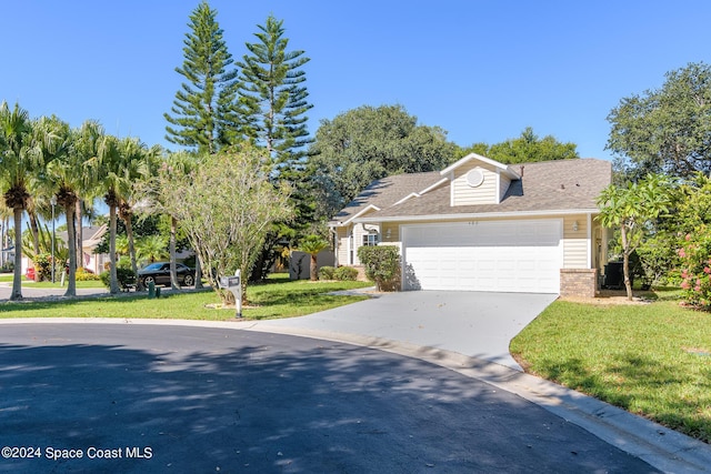 480 Prestwick Ct, Melbourne, FL 32940 - view of front of property featuring concrete driveway, brick siding, an attached garage, and a front lawn