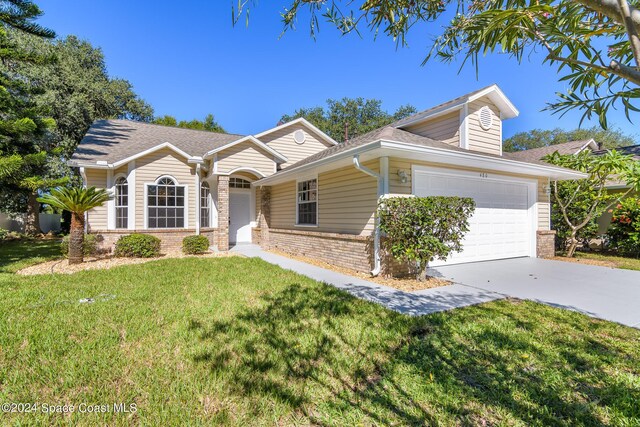 480 Prestwick Ct, Melbourne, FL 32940 - ranch-style home with brick siding, a front lawn, an attached garage, and driveway