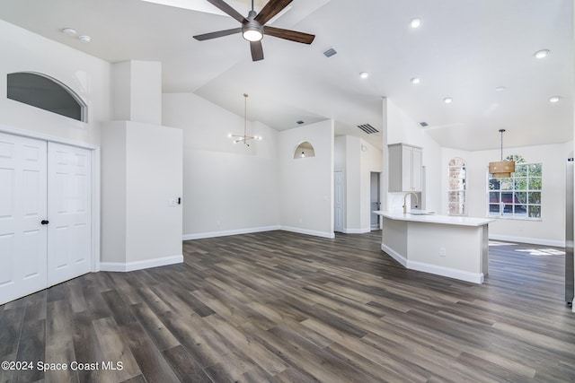 480 Prestwick Ct, Melbourne, FL 32940 - unfurnished living room with visible vents, dark wood-style flooring, baseboards, a sink, and ceiling fan with notable chandelier