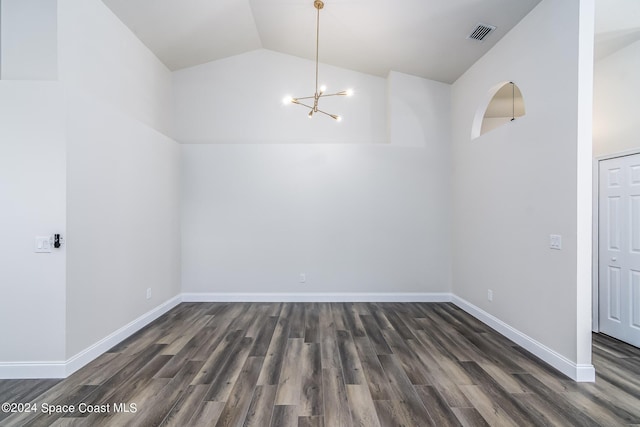 480 Prestwick Ct, Melbourne, FL 32940 - unfurnished dining area featuring a chandelier, baseboards, vaulted ceiling, dark wood-type flooring, and visible vents