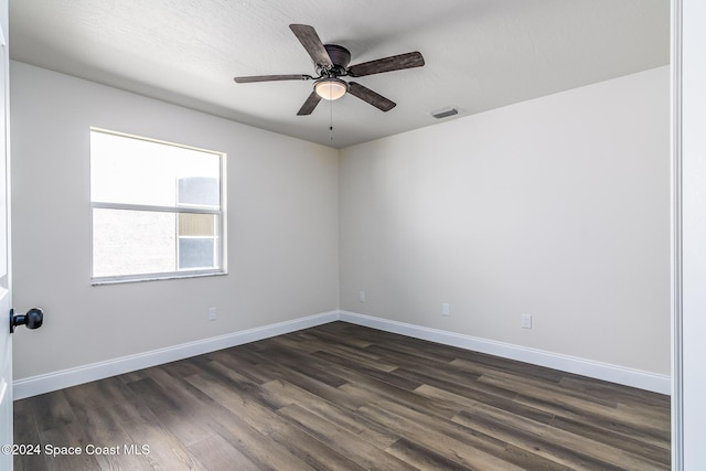 480 Prestwick Ct, Melbourne, FL 32940 - spare room featuring dark wood-style flooring, ceiling fan, visible vents, and baseboards