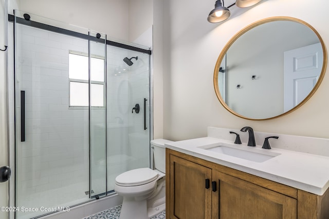 bathroom featuring vanity, a shower with shower door, toilet, and tile patterned floors