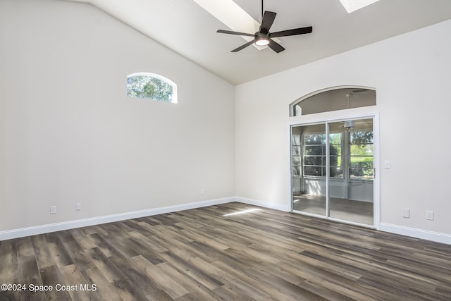 unfurnished room featuring dark hardwood / wood-style floors, high vaulted ceiling, and ceiling fan