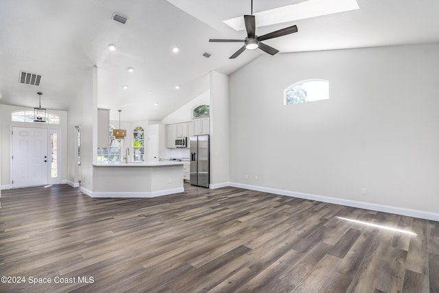 480 Prestwick Ct, Melbourne, FL 32940 - unfurnished living room with visible vents, dark wood-style floors, and high vaulted ceiling