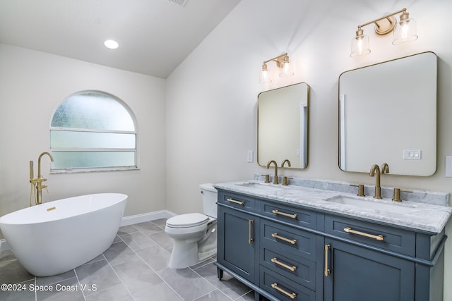 480 Prestwick Ct, Melbourne, FL 32940 - bathroom featuring double vanity, a sink, a freestanding bath, and toilet