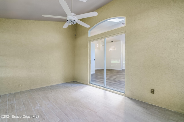 unfurnished room with light hardwood / wood-style flooring and ceiling fan