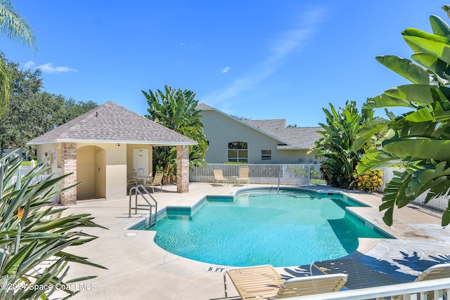 view of swimming pool featuring a patio