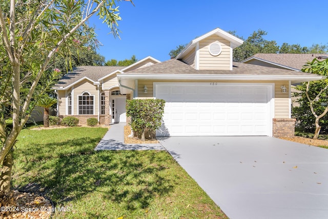 480 Prestwick Ct, Melbourne, FL 32940 - ranch-style house with roof with shingles, a front lawn, brick siding, a garage, and concrete driveway