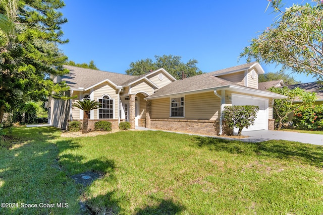 single story home with a garage and a front lawn